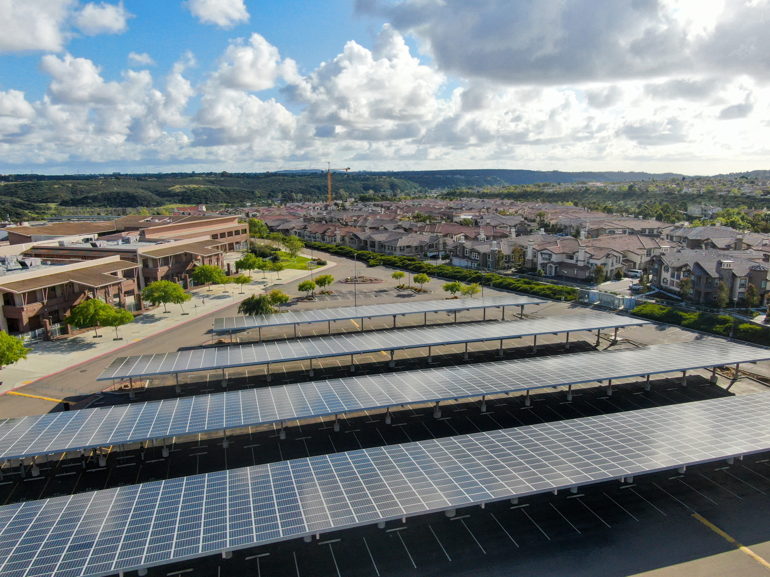 aerial-view-solar-power-plant-installed-top-parking-lot-renewable-energy-solar-panels